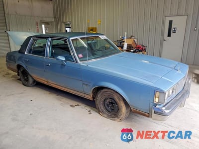 Czwarte zdjęcie samochodu z boku: 1987 OLDSMOBILE CUTLASS SUPREME BROUGHAM VIN:2G3GM51Y4H2335843 - miniatura