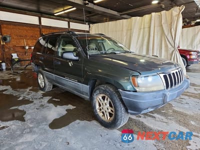 Czwarte zdjęcie samochodu z boku: 2002 JEEP GRAND CHEROKEE LAREDO VIN:1J4GW48SX2C232806 - miniatura