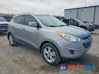 Czwarte zdjęcie samochodu z boku: 2011 HYUNDAI TUCSON GLS VIN:KM8JU3AC4BU239366 - miniatura