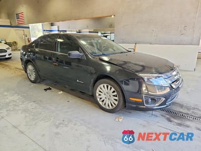 Czwarte zdjęcie samochodu z boku: 2010 FORD FUSION HYBRID VIN:3FADP0L34AR115629 - miniatura