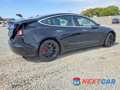Trzecie zdjęcie samochodu z tyłu: 2019 TESLA MODEL 3 VIN:5YJ3E1EB6KF434412 - miniatura