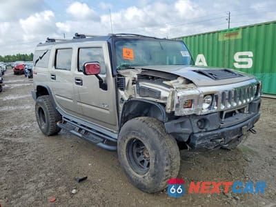 Czwarte zdjęcie samochodu z boku: 2004 HUMMER H2 VIN:5GRGN23U64H111278 - miniatura