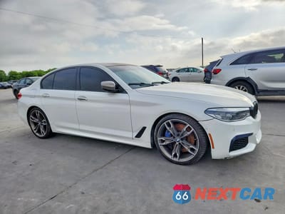 Czwarte zdjęcie samochodu z boku: 2018 BMW M550XI VIN:WBAJB9C54JB036528 - miniatura