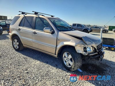 Czwarte zdjęcie samochodu z boku: 2001 MERCEDES-BENZ ML 320 VIN:4JGAB54E51A247152 - miniatura