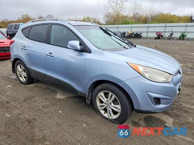 Czwarte zdjęcie samochodu z boku: 2010 HYUNDAI TUCSON GLS VIN:KM8JUCAC6AU053715 - miniatura