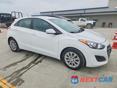 Czwarte zdjęcie samochodu z boku: 2016 HYUNDAI ELANTRA GT BASE VIN:KMHD35LH0GU305004 - miniatura