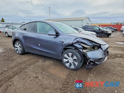 Czwarte zdjęcie samochodu z boku: 2023 TESLA MODEL Y VIN:LRWYGDFD0PC222639 - miniatura