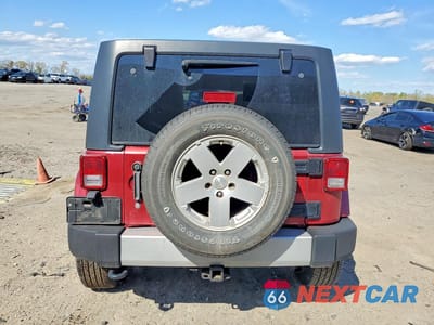 Zdjęcie 6 z 11 samochodu: 2012 JEEP WRANGLER UNLIMITED SAHARA VIN:1C4BJWEG6CL157078 - miniatura