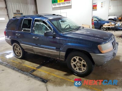 Czwarte zdjęcie samochodu z boku: 2000 JEEP GRAND CHEROKEE LAREDO VIN:1J4GW48S6YC154257 - miniatura