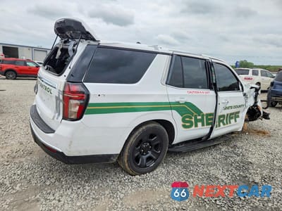 Trzecie zdjęcie samochodu z tyłu: 2022 CHEVROLET TAHOE C1500 VIN:1GNSCLED0NR334651 - miniatura