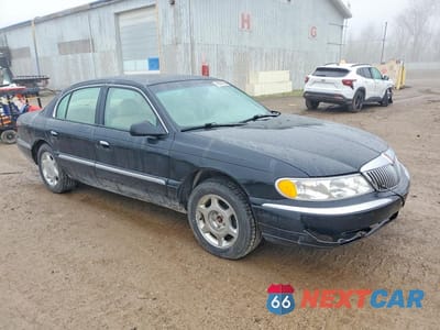 Czwarte zdjęcie samochodu z boku: 1999 LINCOLN CONTINENTAL VIN:1LNHM97V8XY705097 - miniatura