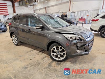 Czwarte zdjęcie samochodu z boku: 2015 FORD ESCAPE TITANIUM VIN:1FMCU9JX8FUB01110 - miniatura