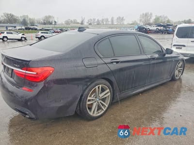 Trzecie zdjęcie samochodu z tyłu: 2018 BMW 750 XI VIN:WBA7F2C51JG424101 - miniatura