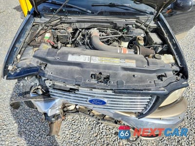 Zdjęcie 11 z 13 samochodu: 2000 FORD F150 VIN:1FTRX18L5YKA03421 - miniatura