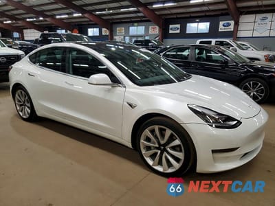Czwarte zdjęcie samochodu z boku: 2019 TESLA MODEL 3 VIN:5YJ3E1EAXKF417507 - miniatura