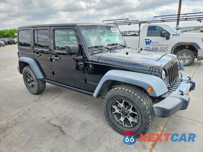 Czwarte zdjęcie samochodu z boku: 2016 JEEP WRANGLER UNLIMITED SPORT VIN:1C4BJWDG7GL103053 - miniatura