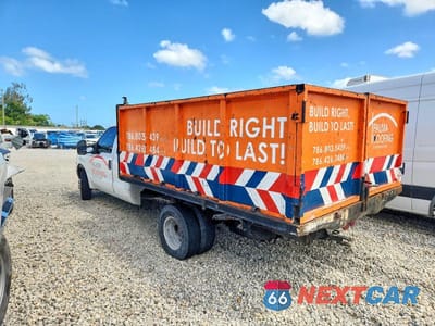 Trzecie zdjęcie samochodu z tyłu: 1999 FORD F350 SUPER DUTY DUMP TRUCK VIN:1FDWX36S1XED73380 - miniatura