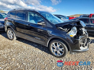 Czwarte zdjęcie samochodu z boku: 2015 FORD ESCAPE TITANIUM VIN:1FMCU9J98FUA27222 - miniatura