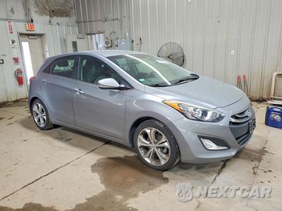 Czwarte zdjęcie samochodu z boku: 2014 HYUNDAI ELANTRA GT BASE VIN:KMHD35LH1EU224509 - miniatura
