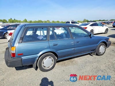 Trzecie zdjęcie samochodu z tyłu: 1992 TOYOTA COROLLA DELUXE VIN:JT2AE94K3N3499106 - miniatura