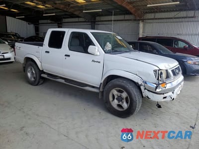 Czwarte zdjęcie samochodu z boku: 2000 NISSAN FRONTIER XE VIN:1N6ED27Y2YC338377 - miniatura