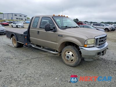 Czwarte zdjęcie samochodu z boku: 2002 FORD F350 SUPER DUTY VIN:1FDWX37F12EB00613 - miniatura