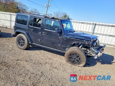 Czwarte zdjęcie samochodu z boku: 2016 JEEP WRANGLER SPORT VIN:1C4BJWDG4GL104841 - miniatura