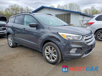Czwarte zdjęcie samochodu z boku: 2018 FORD ESCAPE SE VIN:1FMCU9GD7JUA70065 - miniatura