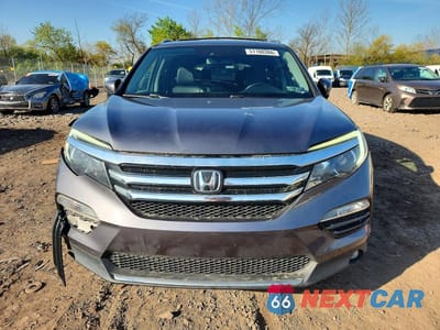 Piąte zdjęcie samochodu w środku: 2016 HONDA PILOT TOURING VIN:5FNYF6H91GB101583 - miniatura