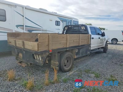 Czwarte zdjęcie samochodu z boku: 2021 FORD F450 SUPER DUTY FLATBED TRUCK VIN:1FD0W4HT9MED04078 - miniatura
