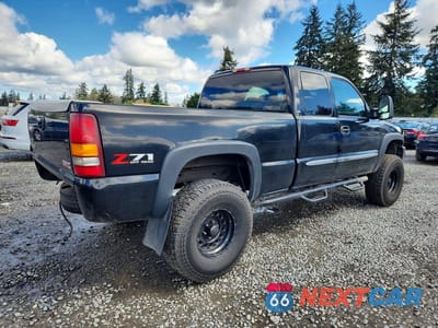 Trzecie zdjęcie samochodu z tyłu: 2003 GMC NEW SIERRA K1500 VIN:1GTEK19T93E288563 - miniatura
