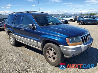 Czwarte zdjęcie samochodu z boku: 2000 JEEP GRAND CHEROKEE LAREDO VIN:1J4GW48S0YC187528 - miniatura