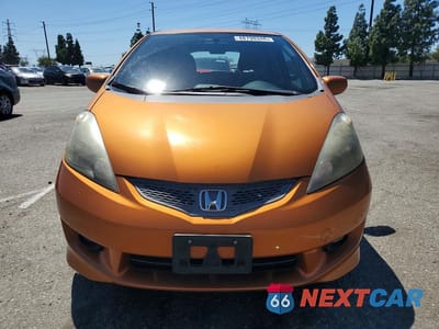 Piąte zdjęcie samochodu w środku: 2009 HONDA FIT SPORT VIN:JHMGE88419S025379 - miniatura