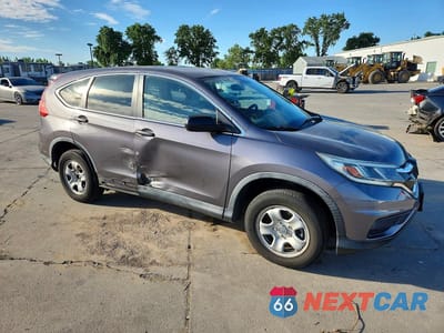 Czwarte zdjęcie samochodu z boku: 2015 HONDA CR-V LX VIN:3CZRM3H39FG700495 - miniatura