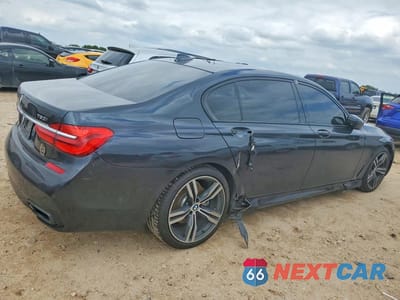 Trzecie zdjęcie samochodu z tyłu: 2019 BMW 750 I VIN:WBA7F0C51KGM24895 - miniatura