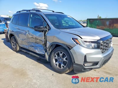 Czwarte zdjęcie samochodu z boku: 2022 HONDA PASSPORT TRAIL SPORT VIN:5FNYF8H65NB005096 - miniatura