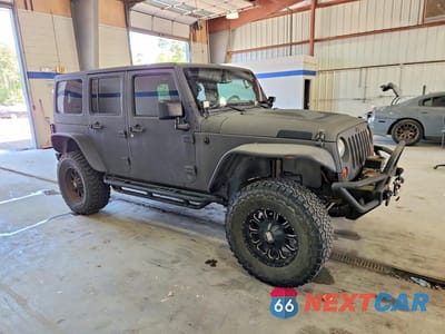 Czwarte zdjęcie samochodu z boku: 2013 JEEP WRANGLER UNLIMITED SPORT VIN:1C4BJWDG1DL506005 - miniatura
