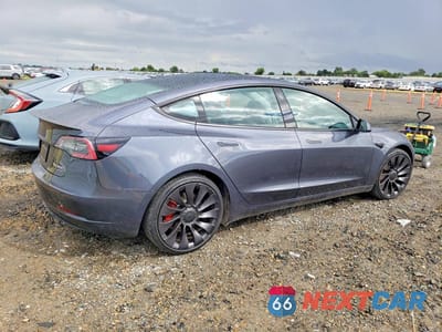 Trzecie zdjęcie samochodu z tyłu: 2022 TESLA MODEL 3 VIN:5YJ3E1EC3NF156579 - miniatura