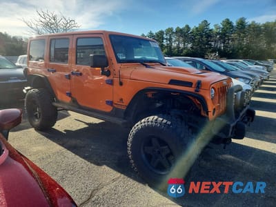 Czwarte zdjęcie samochodu z boku: 2012 JEEP WRANGLER UNLIMITED SPORT VIN:1C4BJWDG0CL244637 - miniatura