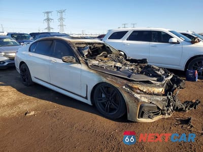 Czwarte zdjęcie samochodu z boku: 2020 BMW 750 XI VIN:WBA7U2C04LCD32651 - miniatura