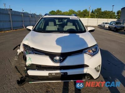 Piąte zdjęcie samochodu w środku: 2018 TOYOTA RAV4 HYBRID XLE VIN:JTMRJREV4JD175228 - miniatura