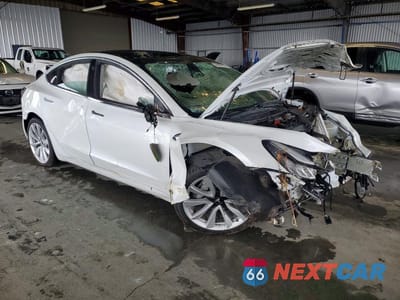 Czwarte zdjęcie samochodu z boku: 2019 TESLA MODEL 3 VIN:5YJ3E1EA9KF332125 - miniatura