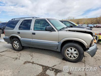 Czwarte zdjęcie samochodu z boku: 1999 GMC JIMMY VIN:1GKDT13WXX2549416 - miniatura