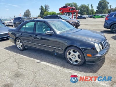 Czwarte zdjęcie samochodu z boku: 2001 MERCEDES-BENZ E 430 VIN:WDBJF70J31X049267 - miniatura