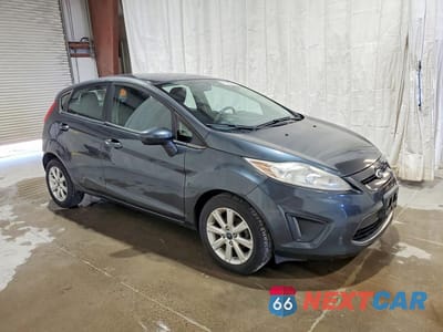 Czwarte zdjęcie samochodu z boku: 2011 FORD FIESTA SE VIN:3FADP4EJ8BM134069 - miniatura