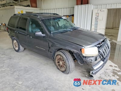 Czwarte zdjęcie samochodu z boku: 2002 JEEP GRAND CHEROKEE LIMITED VIN:1J4GW58N12C263779 - miniatura