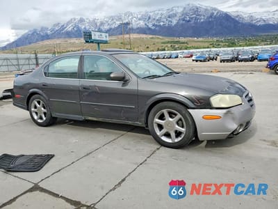 Czwarte zdjęcie samochodu z boku: 2001 NISSAN MAXIMA GXE VIN:JN1CA31A71T100201 - miniatura