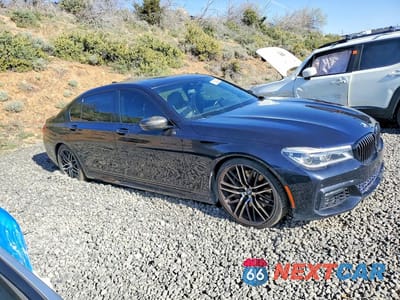 Czwarte zdjęcie samochodu z boku: 2017 BMW 750 I VIN:WBA7F0C33HGM22122 - miniatura