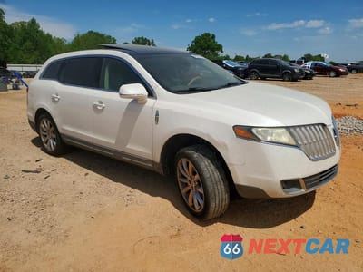 Czwarte zdjęcie samochodu z boku: 2011 LINCOLN MKT VIN:2LMHJ5FR2BBJ51152 - miniatura