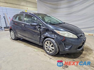 Czwarte zdjęcie samochodu z boku: 2012 FORD FIESTA SE VIN:3FADP4EJ8CM175495 - miniatura